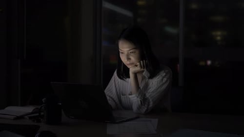 Businesswoman Working Late at Laptop in Dark Office at Night Adult