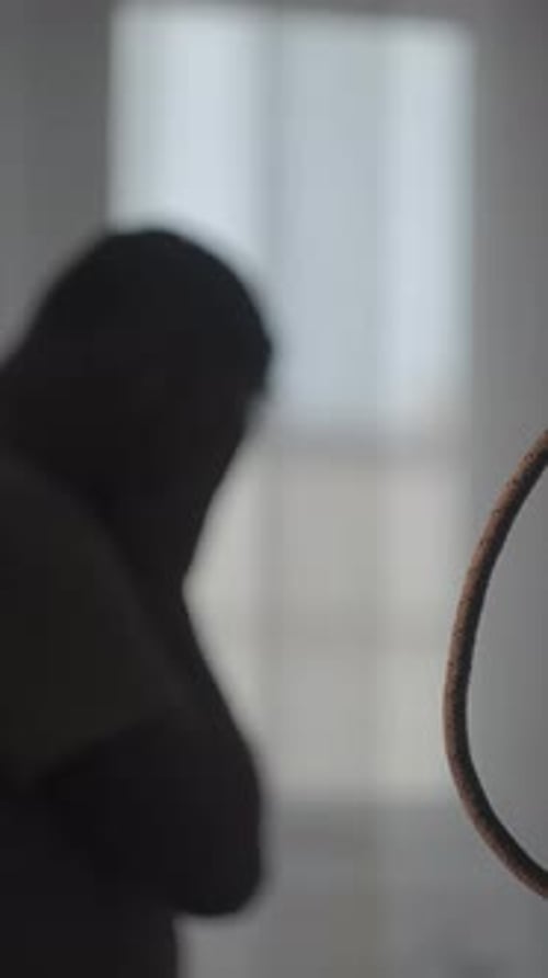 Hanging Rope Noose Indoors Symbolizing Danger Isolation and Fatal Consequences