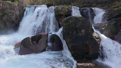 Huge Granite Rocks At Fervenza Da Noveira Waterfall In The Province Of A Coruna, Galicia, Spain. Slo