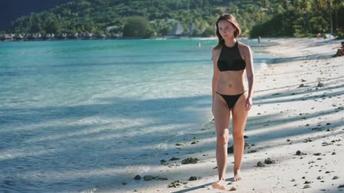 Young Woman Walking on the Beach in a Tropical Paradise