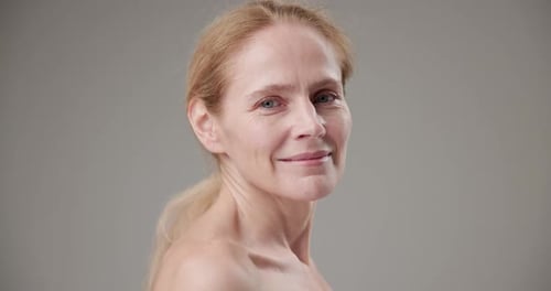 Smiling Woman Posing in Close Up Studio Shot