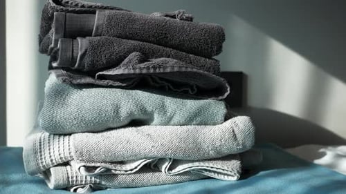 Close Up of Stack of Shower Towel on Table