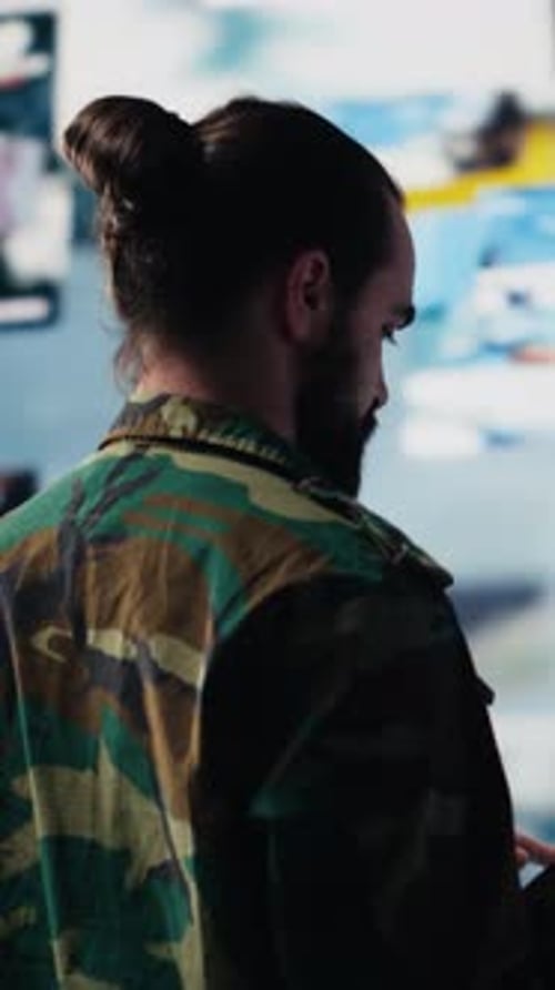 Man With Tablet in an Office-Like Setting