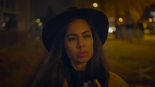 Stylish Woman Taking Photos at Night