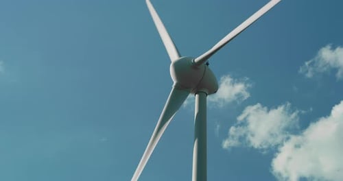 Close up Shot of a Wind Turbine Rotating and Generating Green Ecological Energy for the