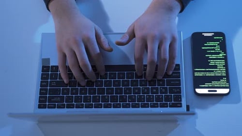 Typing Frustrations on Laptop in Dark Room