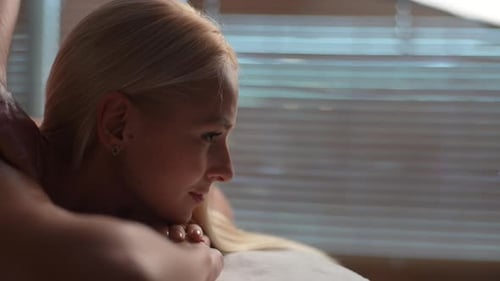 Woman Enjoying a Relaxing Massage at a Spa