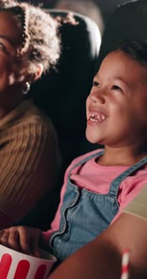 Laughing, movie and funny with child in theater for relax, kids cinema production