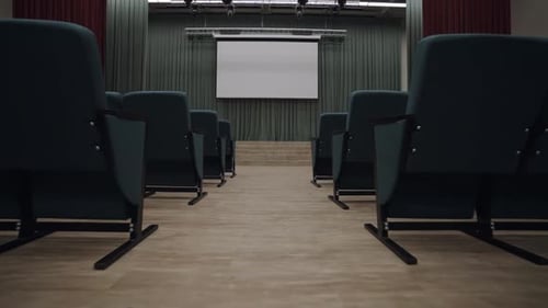 Stage of Auditorium Equipped with Contemporary Projector