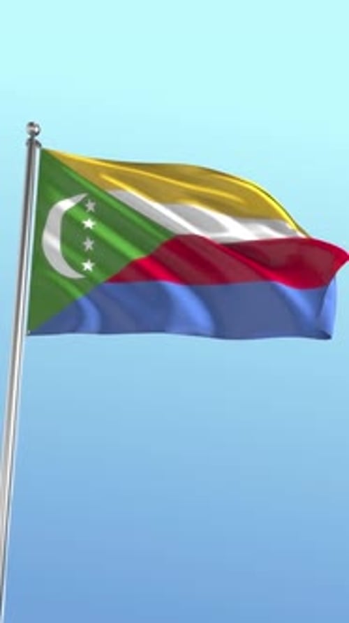 Comoros Flag Waving in Wind Against Blue Sky