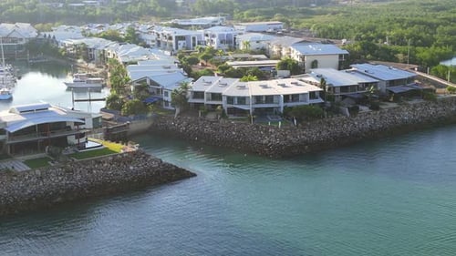 Aerial drone footage. Birds seagulls over blue ocean sea water. Marina docks boats and yachts. Tropi