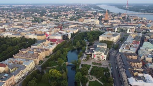 Green park and cityscape of Riga, aerial drone view