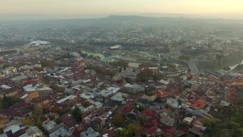 Aerial View of Cityscape with Dense Buildings and River