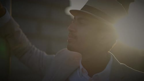 Fashionable Young Handsome Man Wearing a Hat and Casual Clothes in the City