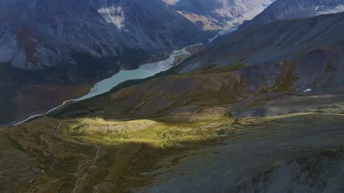 Aerial View of a Turquoise Lake in an Alpine Valley