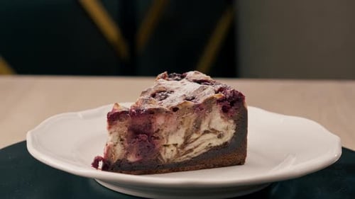 A dessert close-up of a piece of delicious cake lying on a white plate in an Italian restaurant