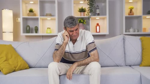 Sad old man is crying.