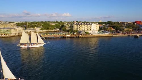 Ship sailing on tropical Caribbean Sea at sunset drone aerial view