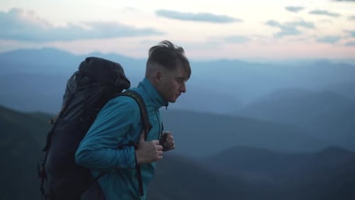 Hiker with Backpack Exploring Mountain Range Vista