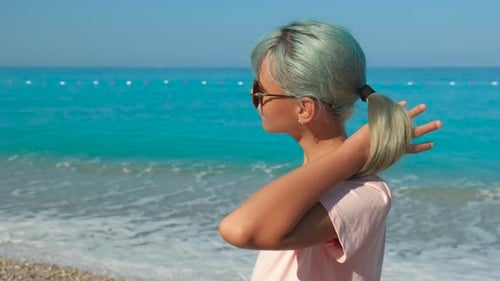 Modern Girl in Bright Sea Sunlight