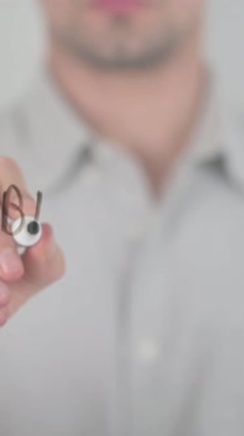 Man Writes "Best Sale" on Transparent Surface Close Up