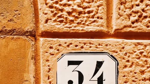 Number 34 (thirty-four) Affixed to a Building