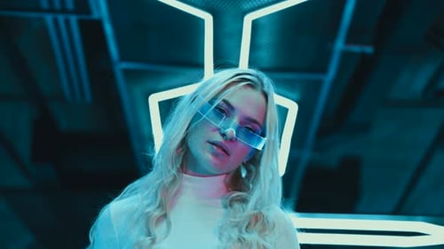 Fashionable Woman Posing in Neon Futuristic Scene