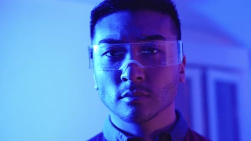 Young Adult Wearing Futuristic Augmented Reality Glasses