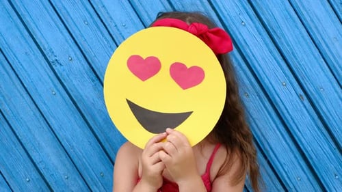 Happy Child with Heart Eyes Emoji Smiling