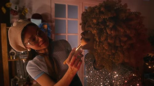 Make-Up Artist Applying Face Powder to Smiling Female Star
