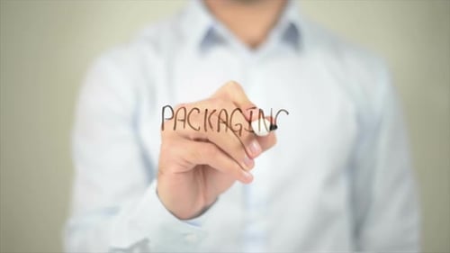 Packaging Man Writing on Transparent Screen