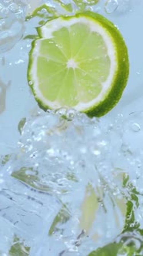 Vertical View Of Lemon into fresh water