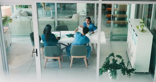 Doctors, meeting and documents in boardroom at hospital, above and review with paperwork