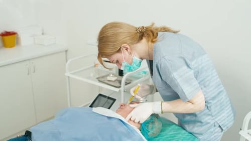 Medical Professional Administers Injection to Patient in Hospital