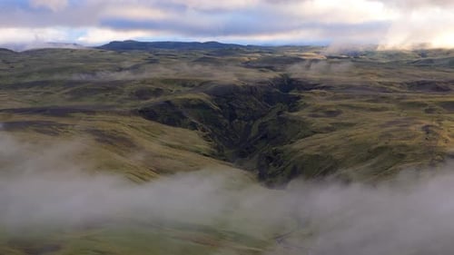 Ethereal Aerial View of Rolling Mist Over the Rugged Landscapes of the Icelandic Highlands