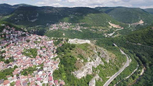 Aerial: White Fortress atop Sarajevo's green hills, Bosnia and Herzegovina