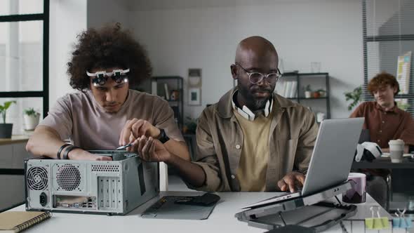 Technician Repairing Computer Hardware, Programmer Searching on ...