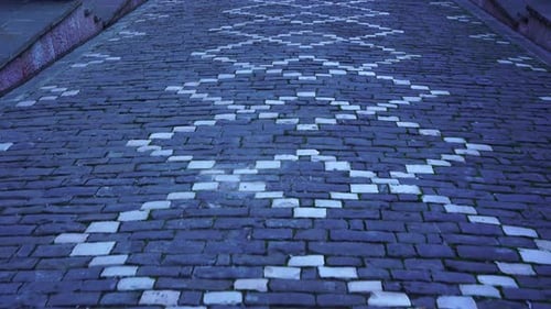 Cobblestones with decorative motifs in the alleys of Gjirokaster old city in Albania