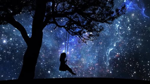 Cinemagraphy: Silhouette of a little girl, swinging on a swing against the background of stars.