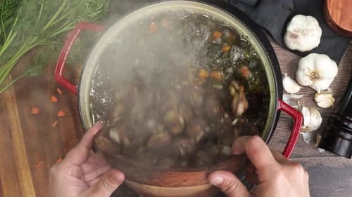 Preparing Hearty Vegetable Soup with Meatballs at Home