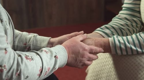 Hands Held in Gentle, Caring Support