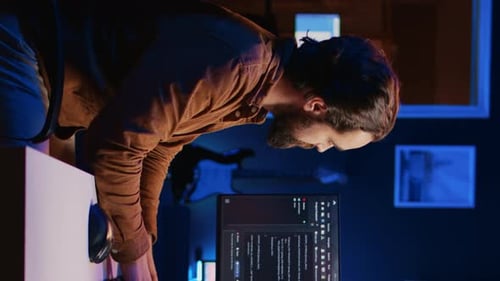 Programmer Developing Code on Computer Screen While in Personal Office