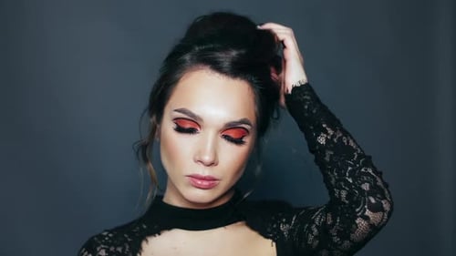 Glamorous Woman Posing with Elegant Makeup and Hair