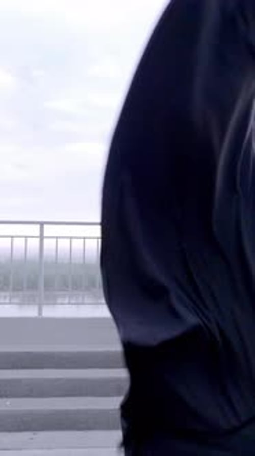 Male Dancer Performing Gracefully with Black Cloth Outdoors