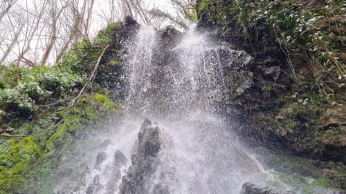 A View of the Upper Part of the Waterfall with Water Cascading Down