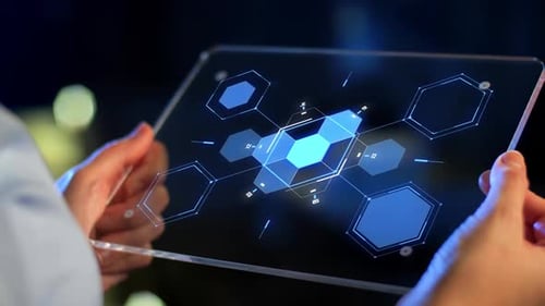 Holographic Tablet Displaying Modern Technology Interface at Night