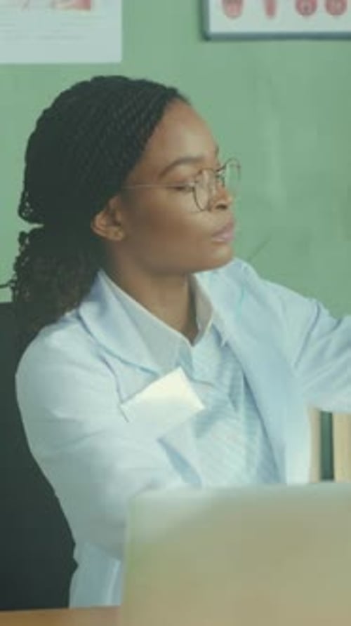 Woman Doctor Explains X-ray in Office