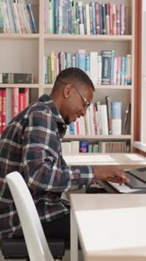 Young Adult Plays Electronic Piano Indoors