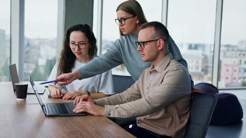 Teamwork in Modern Office With City View