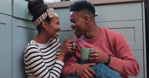 Couple Enjoying Coffee on the Kitchen Floor
